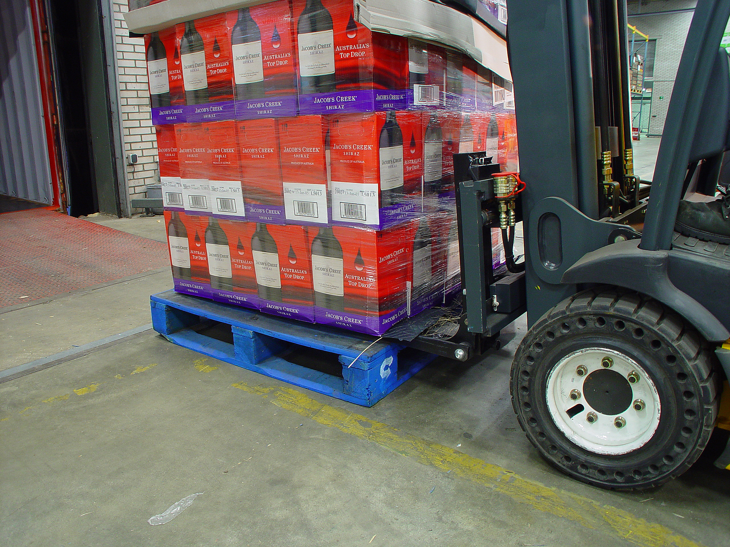 Forklift palletless handling attachment, RollerForks for handling beverages like Australian Wine, Jacob's Creek.