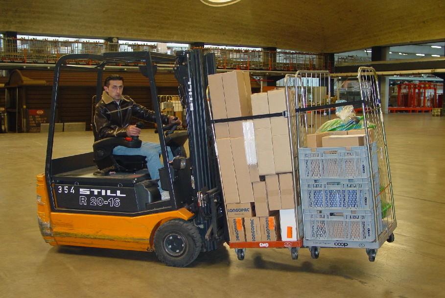 KOOI ReachForks are used at COOP Switzerland to handle dual pallets.