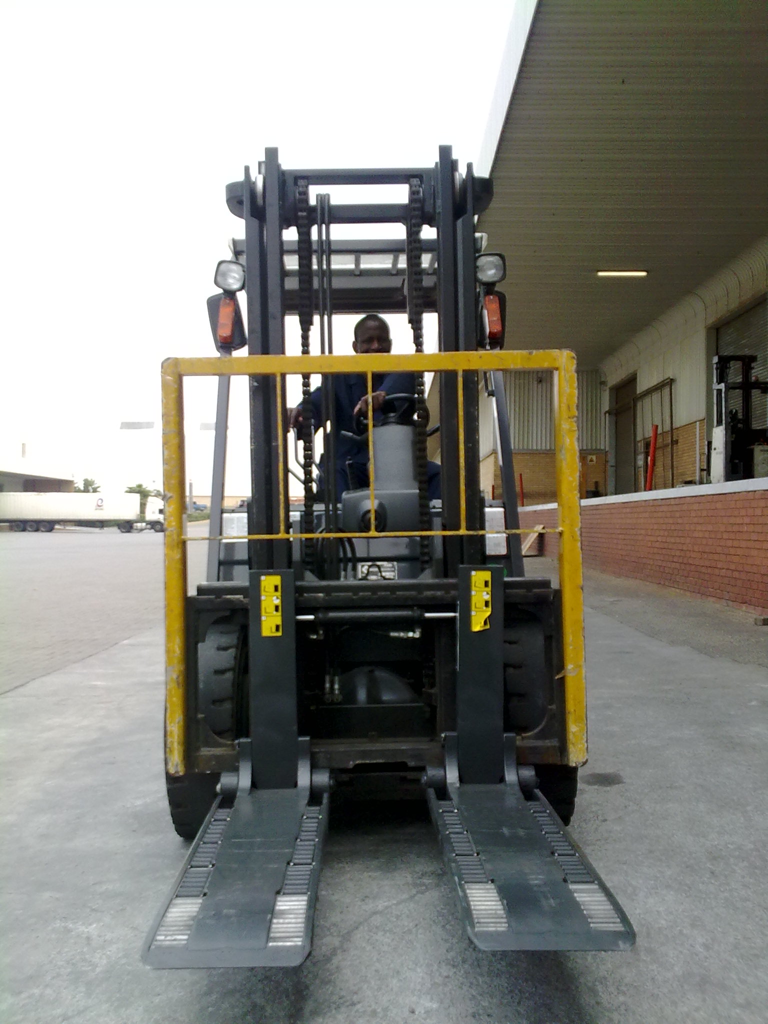 Forklift palletless handling attachment, RollerForks for handling DELL computers at Schenker Logistics