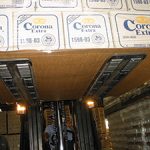 Forklift palletless handling attachment, RollerForks for slip-sheets to handle beverages of beer bottles from Corona Grupo Modelo