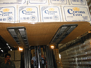 Forklift palletless handling attachment, RollerForks for slip-sheets to handle beverages of beer bottles from Corona Grupo Modelo