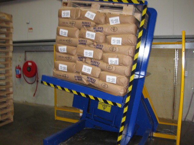 Forklift palletless handling attachment, RollerForks for slip-sheets in combination with pallet inverter.
