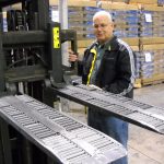 Forklift palletless handling attachment, RollerForks for slipsheets to handle corrugated boxes at Blue Line Distribution, Little Caesars