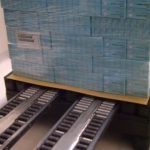 Forklift palletless handling attachment, RollerForks for slipsheets to handle corrugated boxes for a pharmaceutical Roemmers