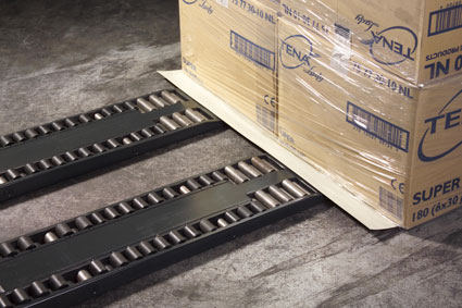 Forklift palletless handling attachment, RollerForks for slip-sheets to handle corrugated boxes with hygiene products.