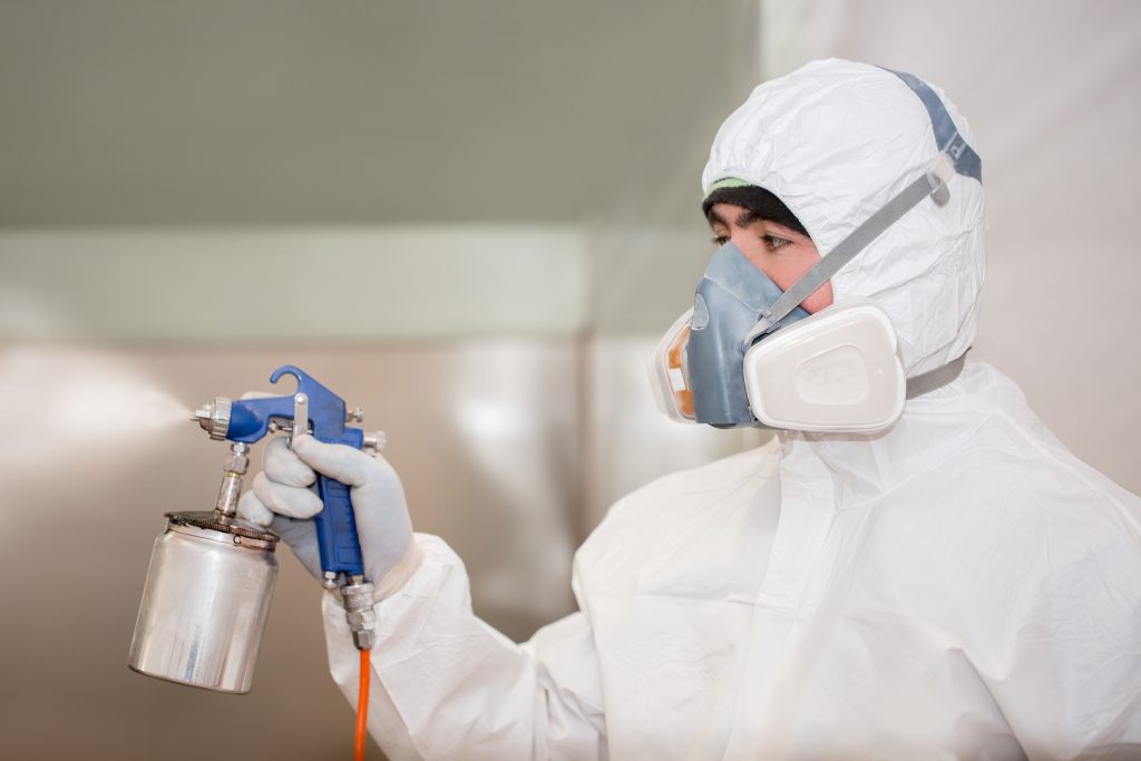 A,Man,In,A,Protective,Suit,In,The,Laboratory,Conducts